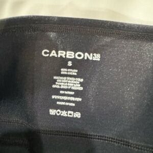 Black Carbon 38 leggings with shiny finish on them. Size small